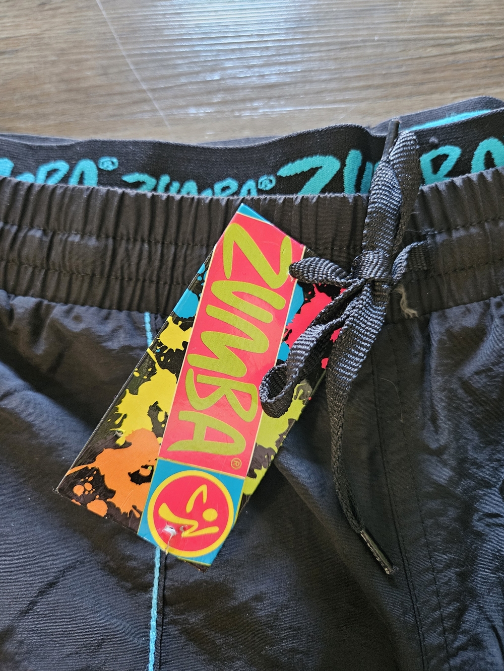 Zumba Fitness Men's Black Zip It Convertible Cargo Pants With Teal Embroidery - Picture 11 of 14